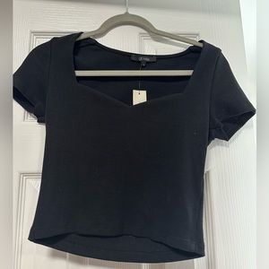 New with tags Francesca’s black shirt. Size small. Heart shape neckline